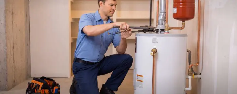 Rivo Plumbing technician working under a sink